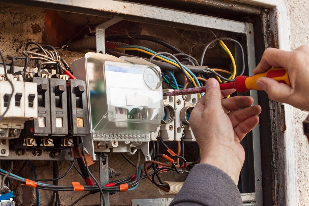repair,of,old,electrical,switchgear.,an,electrician,replaces,old,electrical
