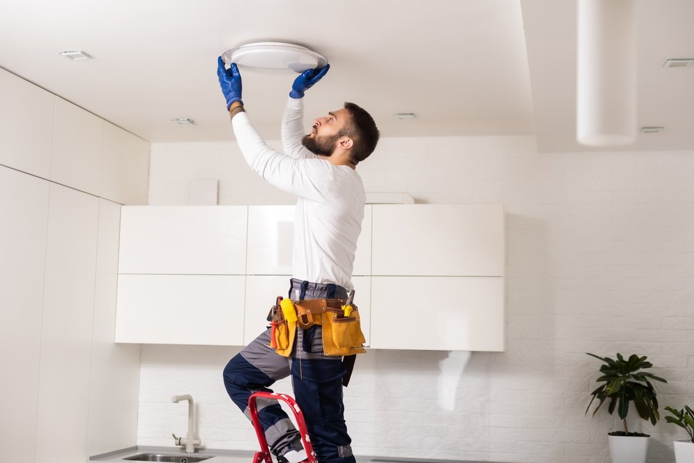electrician,worker,installation,electric,lamps,light,inside,apartment.,construction,decoration